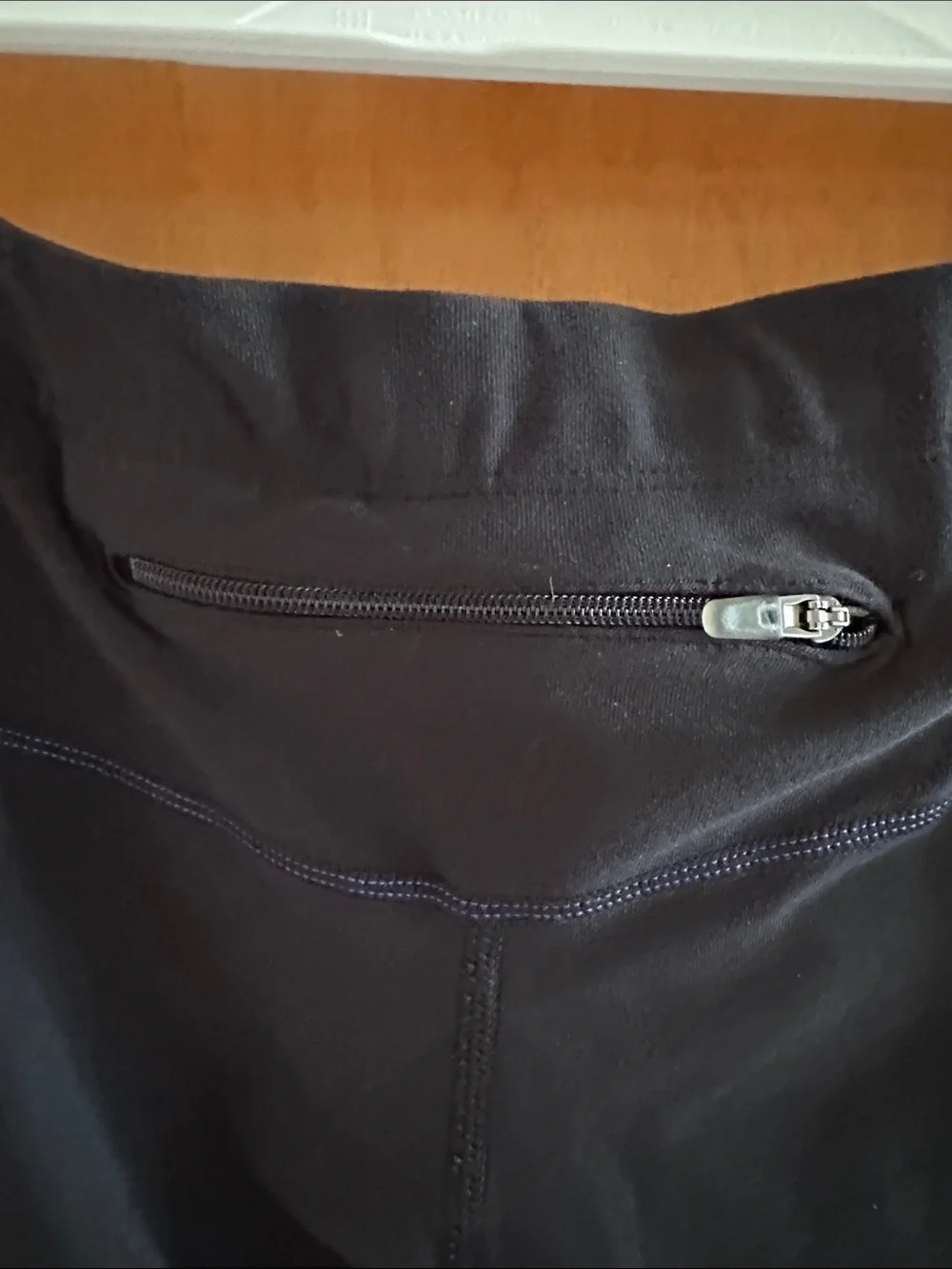Nike Black Capri Leggings with Blue Trim and White Swoosh Back Zip Pocket Capri
